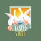 Two Easter Hares or Rabbits and a basket of easter eggs. Text `Easter Sale`.