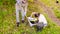 Two ecologist getting samples of soil in city park