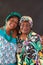 Two elderly African American sisters wearing colorful  turbans