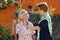 Two elderly ladies chatting in the garden