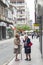 Two elderly women chat in a street