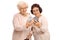 Two elderly women looking at phones