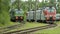 Two electric trains stand on the railway tracks