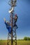 Two electricians install telecommunications antenna system