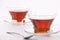 Two elegant cups of black tea