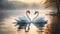 Two elegant swans in love gracefully glide across a serene lake in the forest.