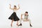 Two emotional dancers in vintage style clothes dancing swing dance, rock-and-roll or lindy hop  on white