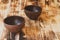Two empty earthenware bowls on a brown wood table