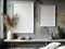 Two empty frames on the grey concrete wall with dried plants in vases and books on the shelf