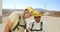 Two engineer discussing over laptop in the wind farm 4k