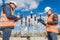 Two engineer electricians check the substation construction process