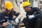 Two engineer man working with machine robot automatic together at factory.