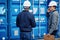 Two engineers tracking containers in a shipping yard