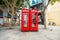 Two English red telephone boxes on street at downtown. Gibraltar