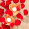 Two enlightened candles in heart-shaped candleholders