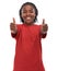 Two enthusiastic thumbs up. A young ethnic boy on a white background.