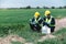 Two Environmental Engineers Inspect Water Quality and Take Water Samples Notes in The Field Near Farmland, Natural Water Sources