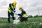 Two Environmental Engineers Take Water Samples at Natural Water Sources Near Farmland Maybe Contaminated by Toxic Waste or