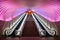 Two Escalators with Pink Light overhead