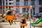 Two European boys swing on a swing in the summer holidays. Children have fun outdoors