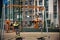 Two European boys swing on a swing in the summer holidays. Children have fun outdoors