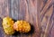 Two exotic kiwano fruits on a wooden backdrop