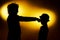 Two expressive boy\'s silhouettes showing emotions using gesticu