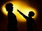 Two expressive boy\'s silhouettes showing emotions using gesticu