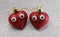 two eyes on red glitter hearts on glittering silver background