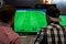 Two fair visitors play the game Pro Evolution Soccer