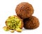 Two falafels and a broken half on a white background. Isolated