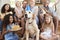 Two families celebrating pet dogï¿½s birthday at home