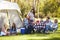 Two Families Enjoying Camping Holiday In Countryside