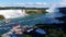 Two famous waterfalls of Niagara Falls with tourist boats