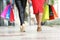 Two fashion women legs walking with shopping bags