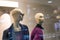 Two fashionable and stylish mannequins in modern glasses and warm business clothes. The concept of selling quality and