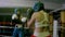 Two female boxers in helmets and boxing gloves training in ring
