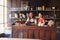 Two Female Coffee Shop Owners Standing Behind Counter