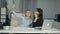 Two female colleagues taking selfie with phone in the office