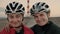 Two female cyclists look in camera and smile