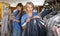 Two female dry-cleaning salon employees