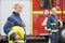 Two female firefighters by a fire engine