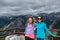 Two female friends 20s pose together at an overlook along Montana Beartooth Pass