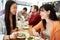 Two Female Friends Friends Meeting For Lunch In Coffee Shop