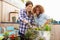 Two Female Friends Planting Rooftop Garden Together