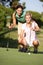 Two Female Golfers On Golf Course