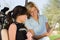 Two female golfers reading notes in golf cart