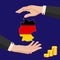 Two female hands around the map of Germany in national flag colors