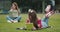 Two Female High School Students Chatting Outside College Buildings