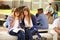 Two Female High School Students Working On Campus